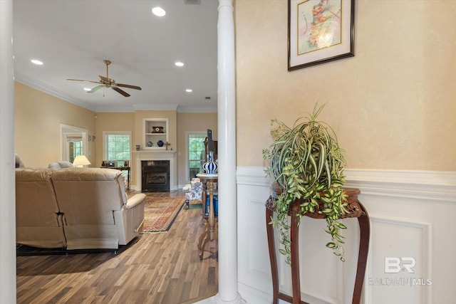 1521 E Peyton Dr, Mobile, AL 36695 - living room with a ceiling fan, wainscoting, wood finished floors, crown molding, and recessed lighting