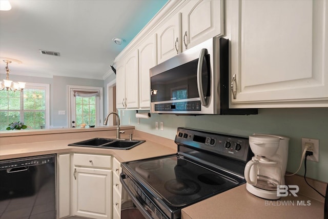 1521 E Peyton Dr, Mobile, AL 36695 - kitchen featuring black appliances, a sink, crown molding, a chandelier, and white cabinetry