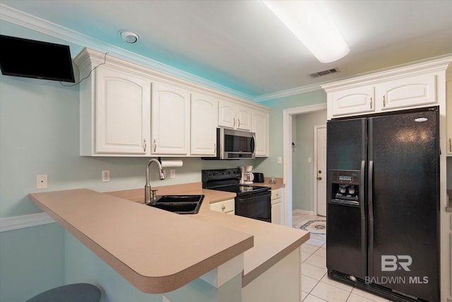 1521 E Peyton Dr, Mobile, AL 36695 - kitchen featuring black appliances, a sink, a peninsula, light countertops, and light tile patterned floors