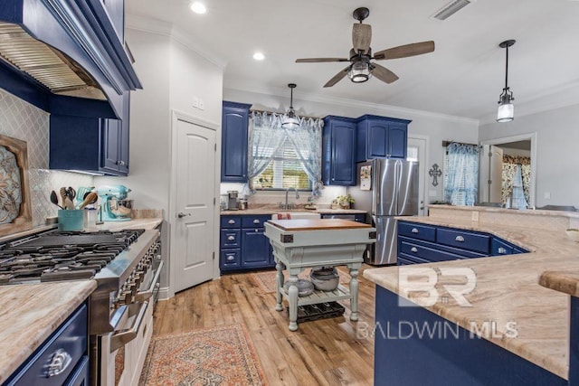 kitchen featuring blue cabinetry, light hardwood / wood-style floors, custom exhaust hood, and appliances with stainless steel finishes