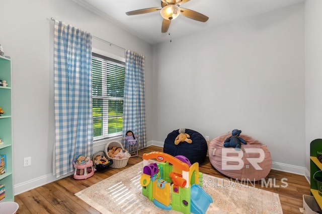 rec room featuring hardwood / wood-style flooring and ceiling fan