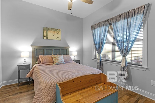 bedroom featuring hardwood / wood-style floors and ceiling fan