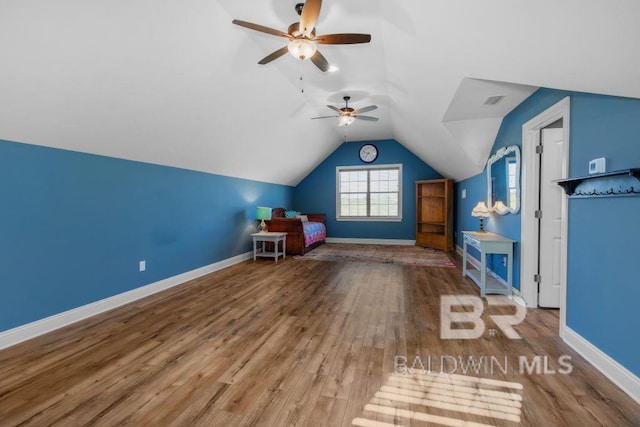 playroom featuring wood-type flooring, ceiling fan, and lofted ceiling