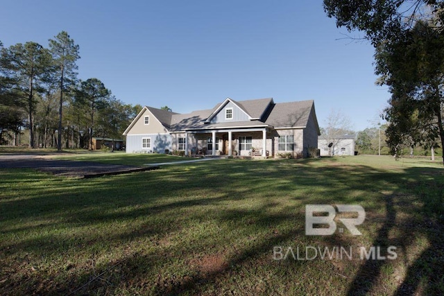 view of front of property featuring a porch and a front lawn