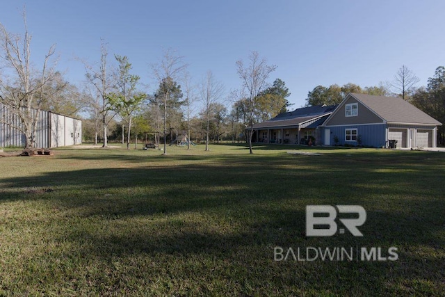 view of yard featuring a garage