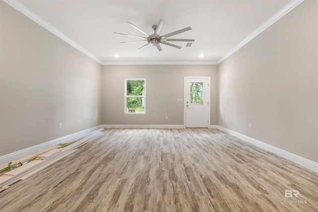 empty room featuring ceiling fan, ornamental molding, and light hardwood / wood-style flooring