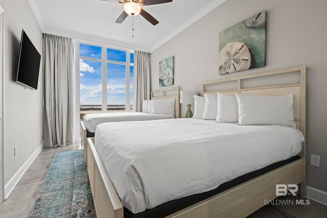 bedroom featuring ceiling fan, ornamental molding, and light tile patterned flooring
