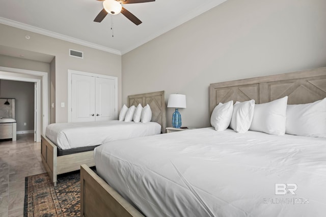 bedroom featuring a closet, ceiling fan, and ornamental molding
