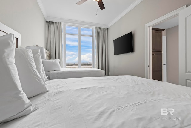 bedroom featuring ceiling fan and crown molding