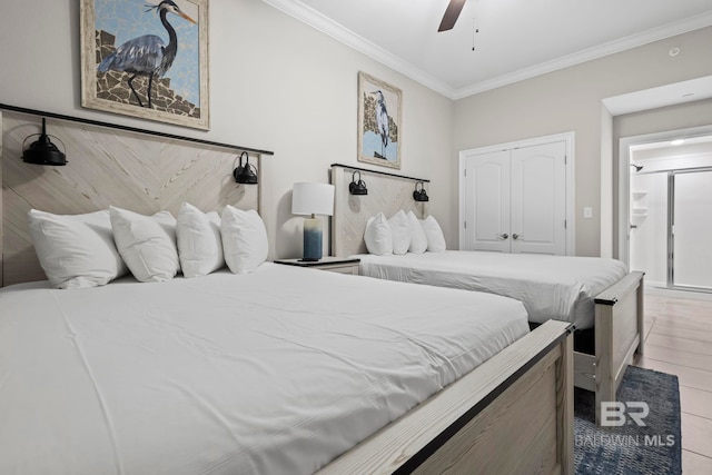 bedroom with ceiling fan, a closet, and ornamental molding