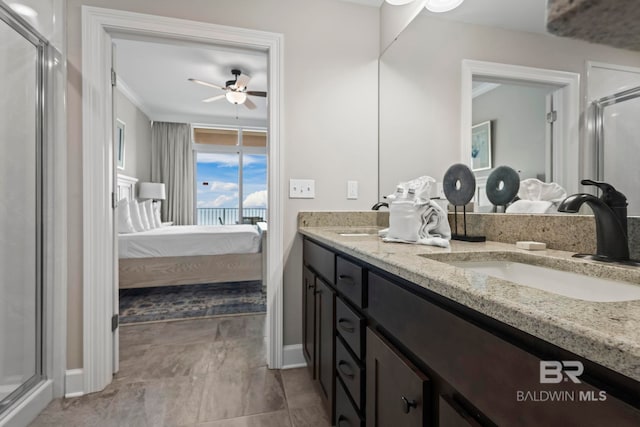 bathroom with ceiling fan, tile patterned floors, crown molding, vanity, and a shower with shower door