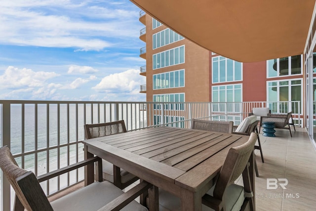 balcony featuring a water view