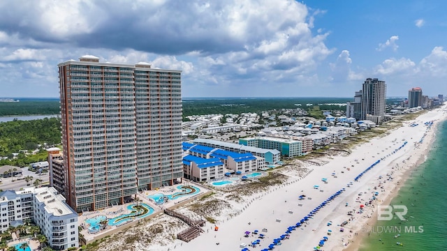 aerial view featuring a view of the beach and a water view