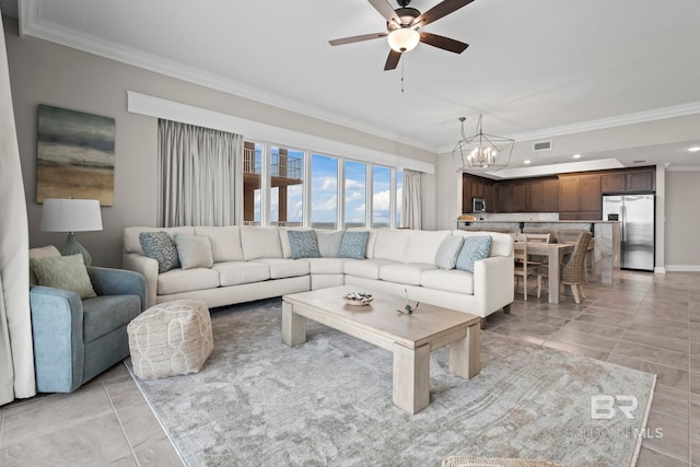 living room with ceiling fan with notable chandelier and ornamental molding