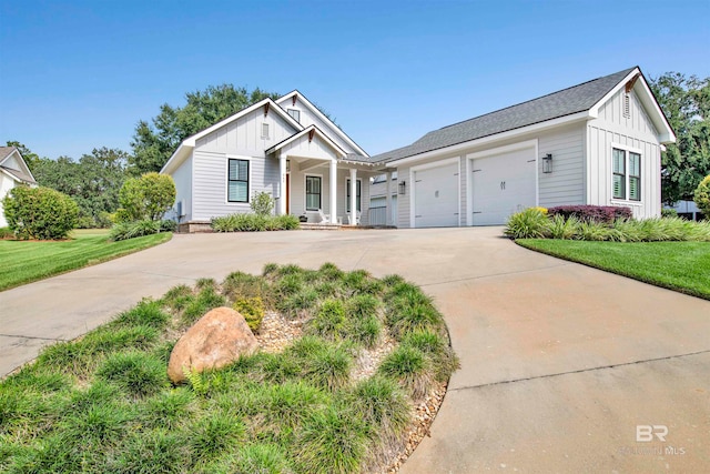 view of front of property with a front lawn and a garage