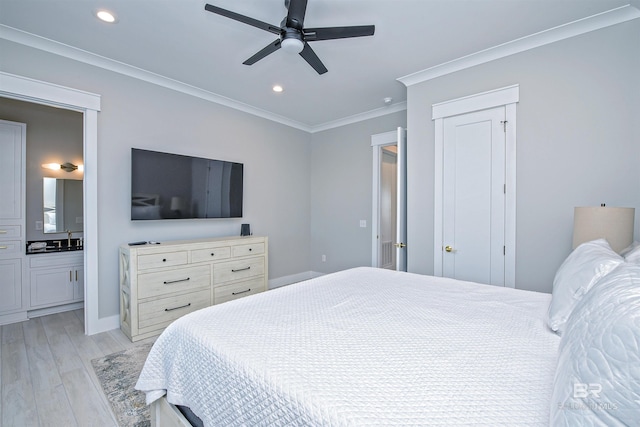 bedroom featuring sink, light hardwood / wood-style flooring, ceiling fan, connected bathroom, and ornamental molding