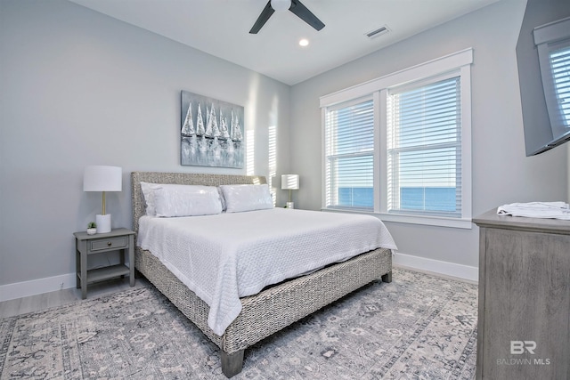 bedroom featuring hardwood / wood-style flooring and ceiling fan