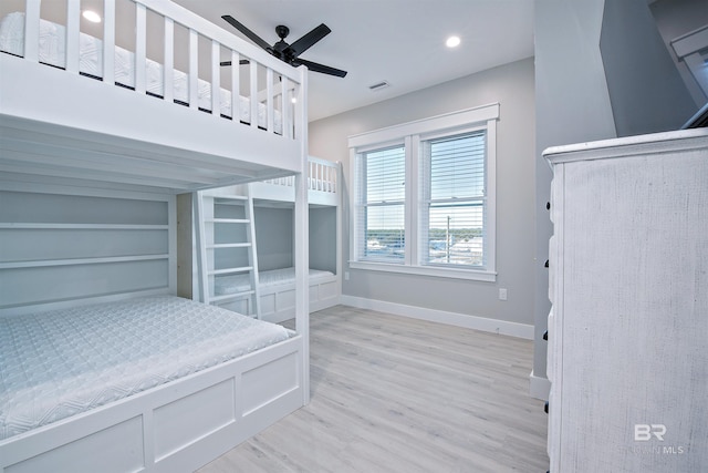 bedroom with ceiling fan and light hardwood / wood-style floors