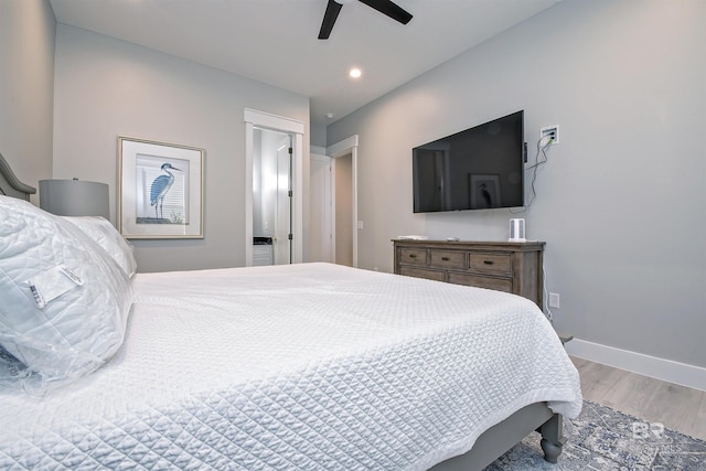 bedroom featuring hardwood / wood-style floors and ceiling fan