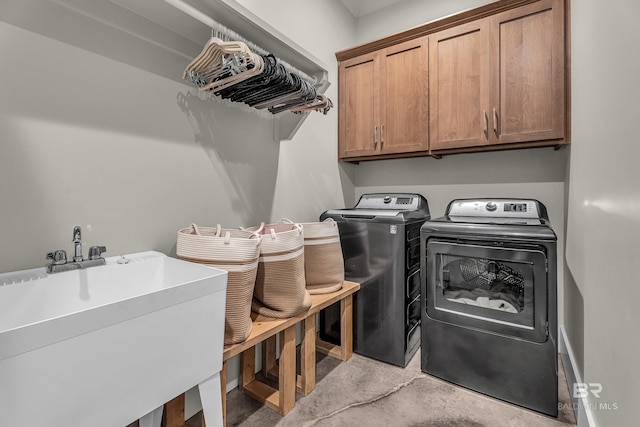 laundry area with washing machine and dryer and cabinet space