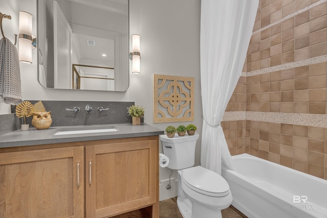 full bathroom featuring toilet, vanity, and shower / bath combo