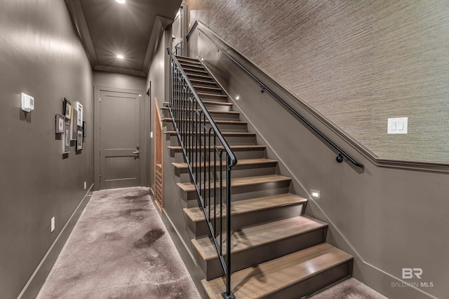 stairway with baseboards and recessed lighting