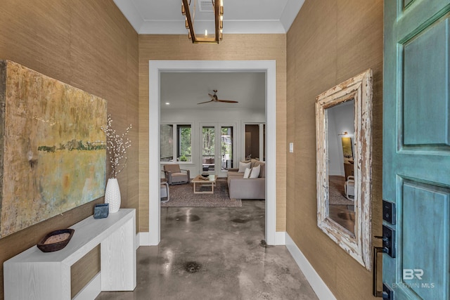 corridor featuring concrete floors and baseboards