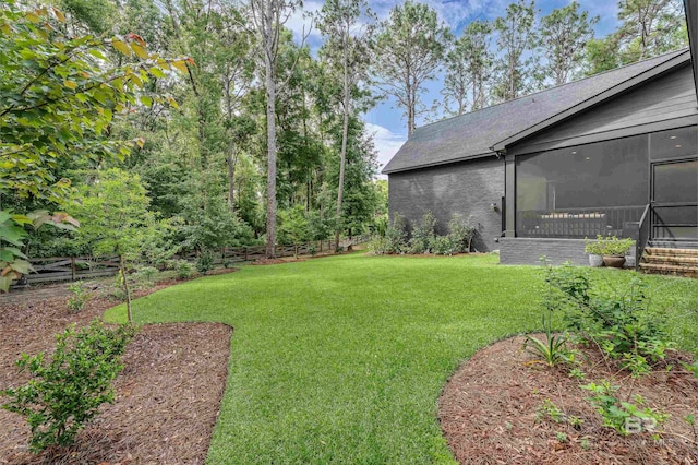 view of yard with a sunroom