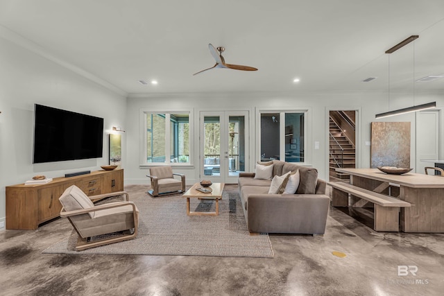 living room featuring ornamental molding, concrete floors, french doors, baseboards, and recessed lighting