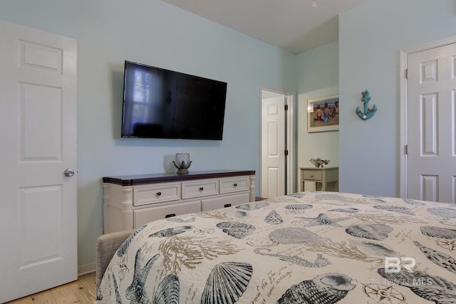 bedroom with light wood finished floors