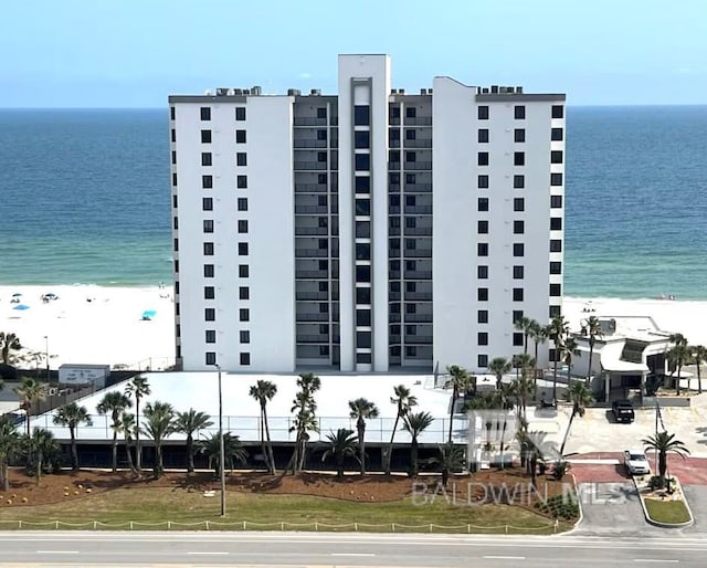 view of property featuring a water view and a view of the beach