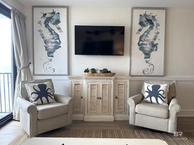 living area with wood-type flooring