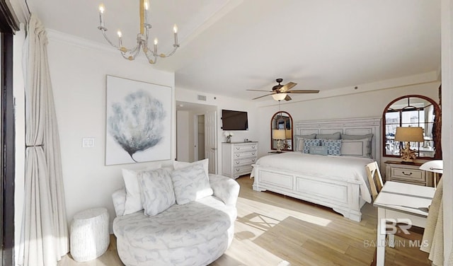 bedroom featuring ceiling fan with notable chandelier, ornamental molding, and light hardwood / wood-style floors