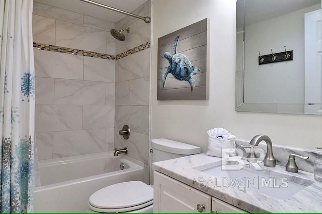 full bathroom with vanity, shower / tub combo with curtain, and toilet