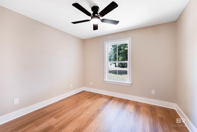 empty room with light wood-type flooring, baseboards, and ceiling fan