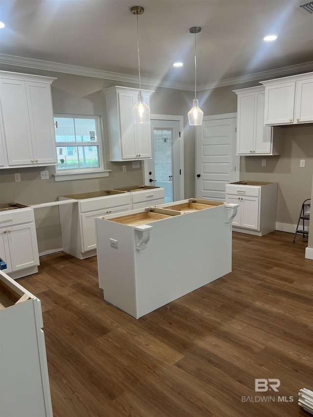 kitchen with recessed lighting, ornamental molding, white cabinetry, and dark wood-style floors