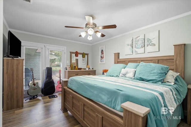 bedroom with ceiling fan, crown molding, and dark hardwood / wood-style flooring