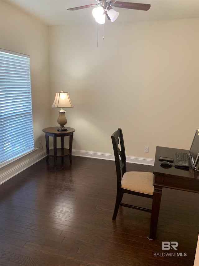 office with dark wood-type flooring and ceiling fan