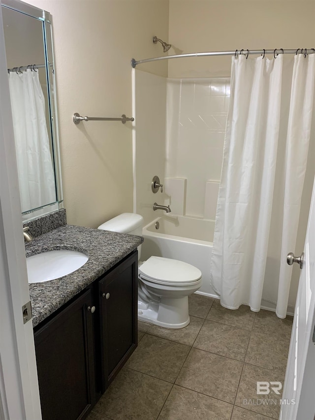 full bathroom featuring shower / tub combo, tile patterned floors, toilet, and vanity