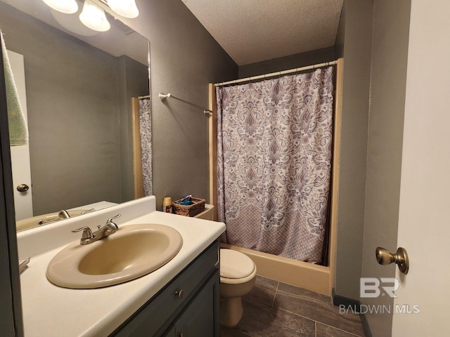 bathroom featuring toilet, a shower with curtain, tile patterned floors, a textured ceiling, and vanity