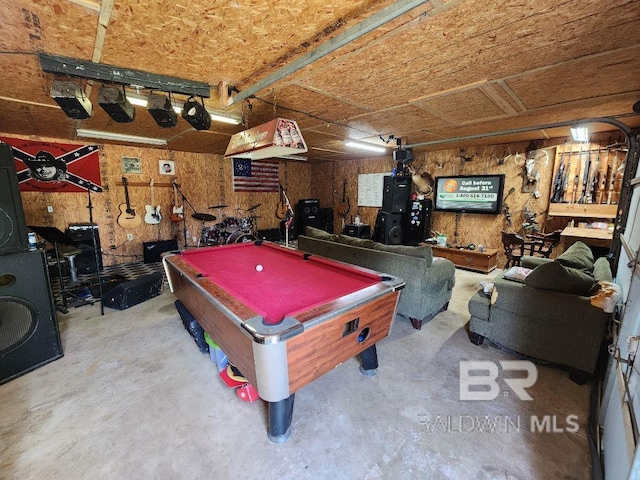 playroom with a garage, pool table, and concrete floors