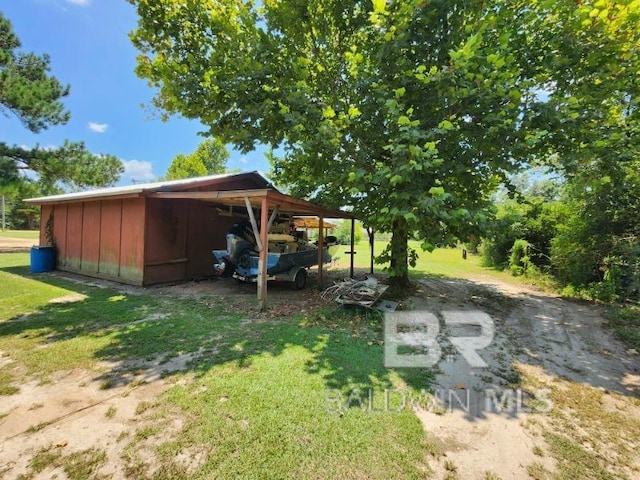 exterior space with an outbuilding and a detached carport