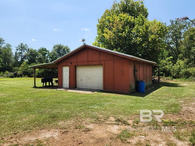 garage with a lawn