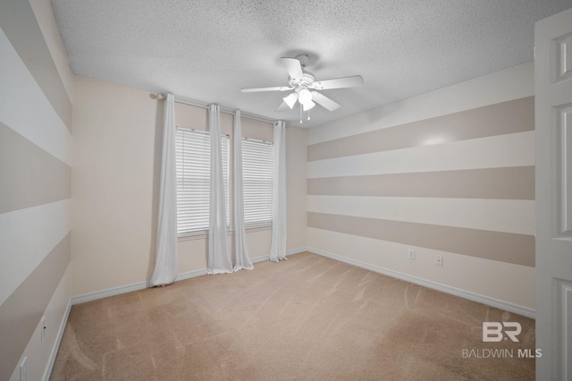 7750 Charleston Oaks Dr, Daphne, AL 36526 - empty room with carpet floors, a ceiling fan, a textured ceiling, and baseboards