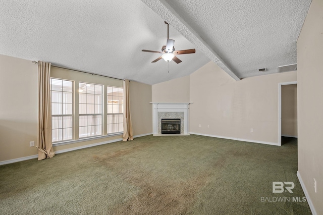 7750 Charleston Oaks Dr, Daphne, AL 36526 - unfurnished living room with vaulted ceiling, carpet floors, a ceiling fan, and a textured ceiling