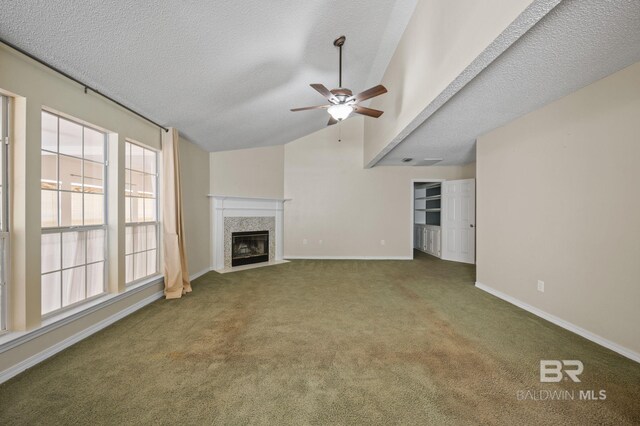 7750 Charleston Oaks Dr, Daphne, AL 36526 - unfurnished living room with carpet floors, a fireplace, baseboards, a textured ceiling, and a ceiling fan