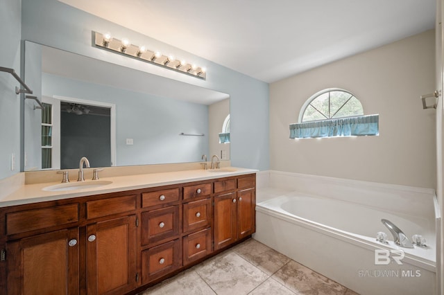 7750 Charleston Oaks Dr, Daphne, AL 36526 - bathroom with a sink, tile patterned floors, a garden tub, and double vanity