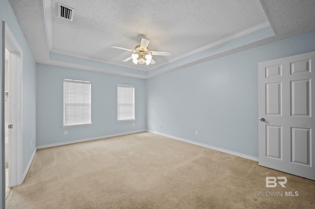 7750 Charleston Oaks Dr, Daphne, AL 36526 - unfurnished bedroom with a textured ceiling, visible vents, light carpet, and a raised ceiling