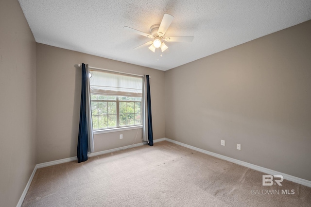 7750 Charleston Oaks Dr, Daphne, AL 36526 - carpeted empty room featuring baseboards, a ceiling fan, and a textured ceiling