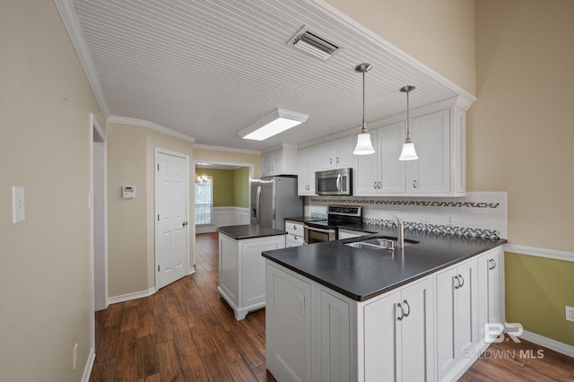 7750 Charleston Oaks Dr, Daphne, AL 36526 - kitchen with dark countertops, appliances with stainless steel finishes, a sink, a kitchen island, and visible vents